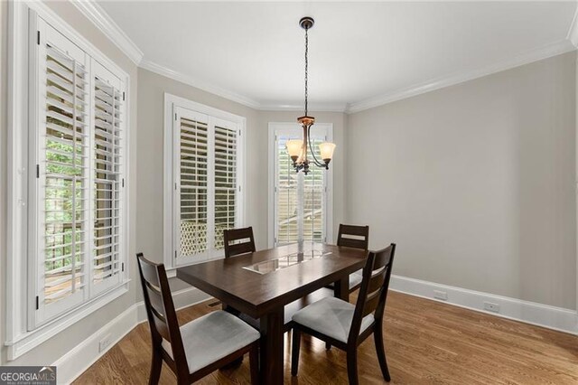 3311 Marina View Way, Gainesville, GA 30506 - dining room with a chandelier, crown molding, and wood finished floors
