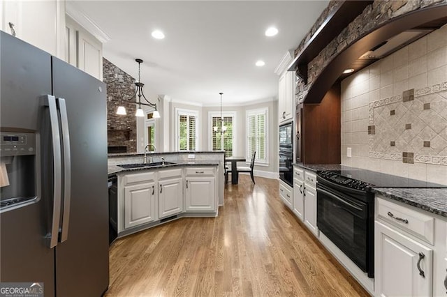 3311 Marina View Way, Gainesville, GA 30506 - kitchen featuring black appliances, tasteful backsplash, white cabinets, light wood-style flooring, and decorative light fixtures