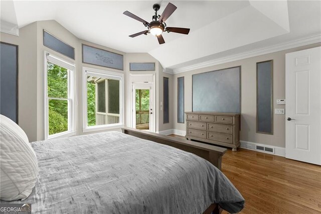 3311 Marina View Way, Gainesville, GA 30506 - bedroom featuring multiple windows, vaulted ceiling, wood finished floors, and a ceiling fan