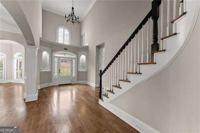 3311 Marina View Way, Gainesville, GA 30506 - foyer with a towering ceiling, crown molding, plenty of natural light, stairs, and ornate columns