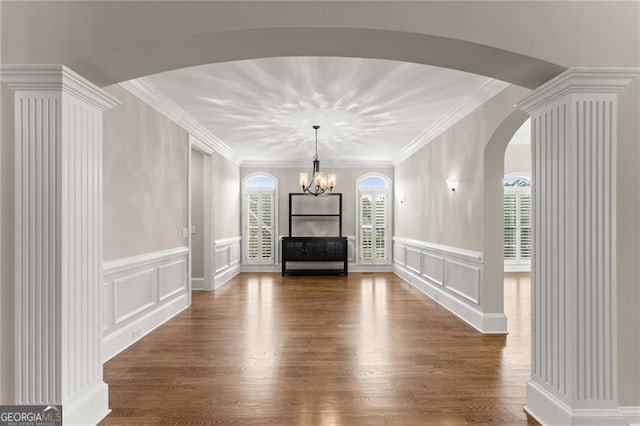 3311 Marina View Way, Gainesville, GA 30506 - living area with a decorative wall, plenty of natural light, arched walkways, wood finished floors, and a chandelier