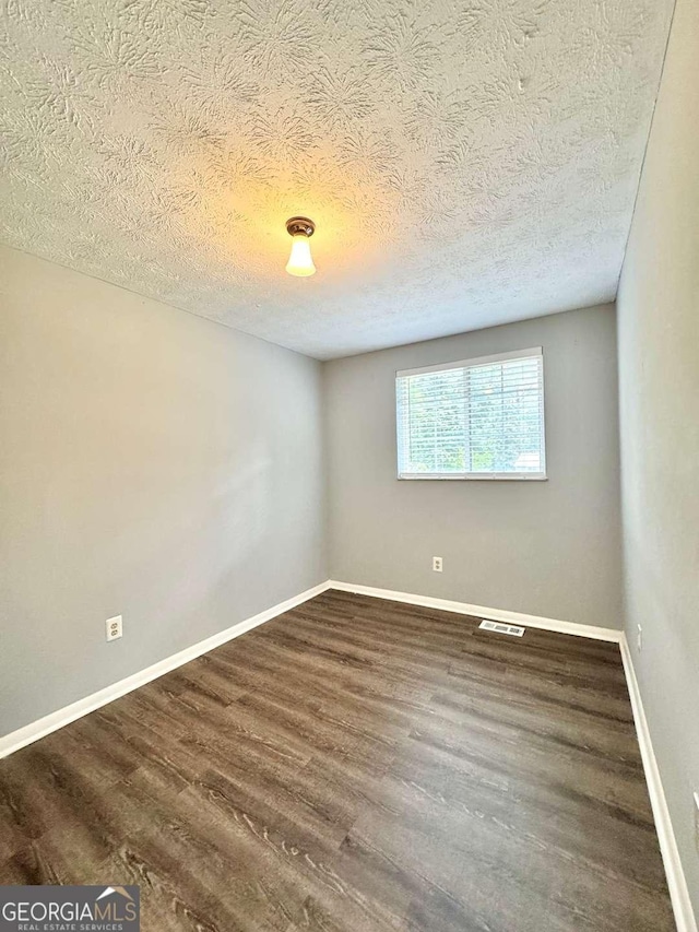 3544 Citrus Dr, Duluth, GA 30096 - empty room featuring wood finished floors and a textured ceiling