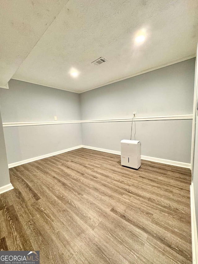 3544 Citrus Dr, Duluth, GA 30096 - unfurnished room featuring wood finished floors and a textured ceiling