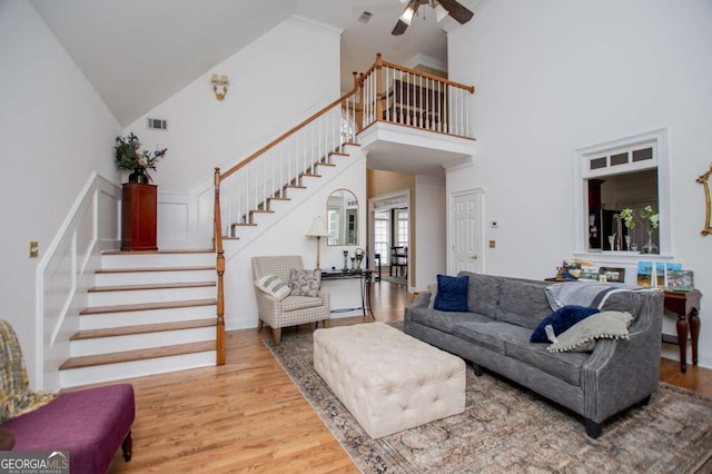 204 Pinehurst Way, Carrollton, GA 30116 - living room with high vaulted ceiling, stairs, a ceiling fan, and wood finished floors
