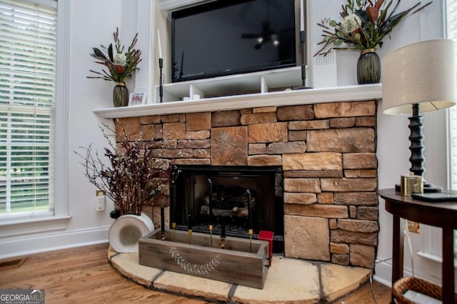 204 Pinehurst Way, Carrollton, GA 30116 - detailed view of wood finished floors and a stone fireplace