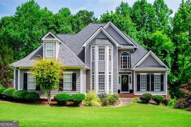 204 Pinehurst Way, Carrollton, GA 30116 - view of front of home with a front yard and roof with shingles