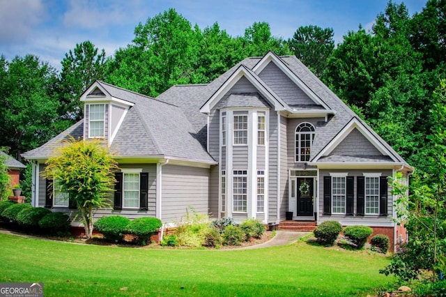 204 Pinehurst Way, Carrollton, GA 30116 - view of front of property with a front lawn and a shingled roof