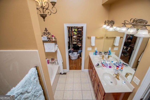 204 Pinehurst Way, Carrollton, GA 30116 - full bath with double vanity, tile patterned flooring, a bath, and a chandelier