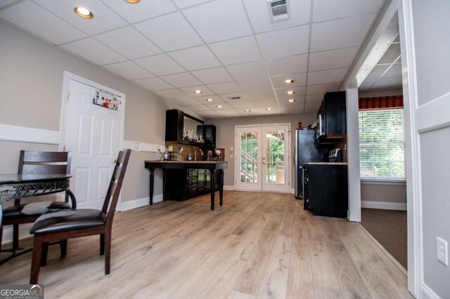 204 Pinehurst Way, Carrollton, GA 30116 - dining room featuring bar, plenty of natural light, light wood-style flooring, a paneled ceiling, and recessed lighting