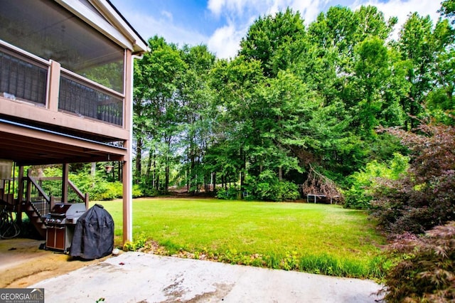 204 Pinehurst Way, Carrollton, GA 30116 - view of grassy yard featuring a patio, stairway, and view of wooded area