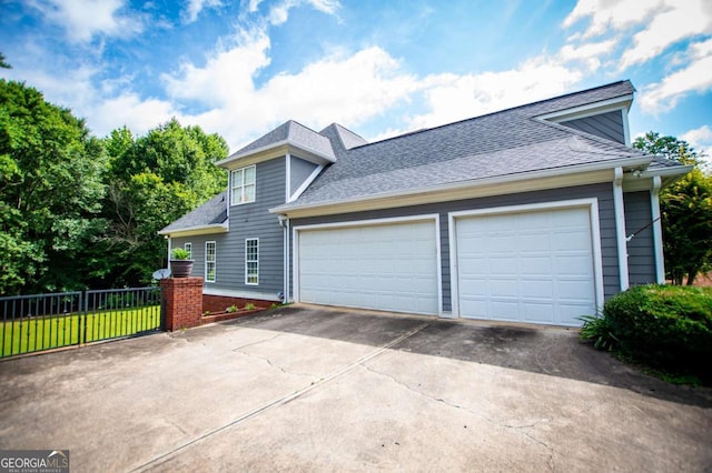 204 Pinehurst Way, Carrollton, GA 30116 - view of front of property with concrete driveway, a garage, and a shingled roof