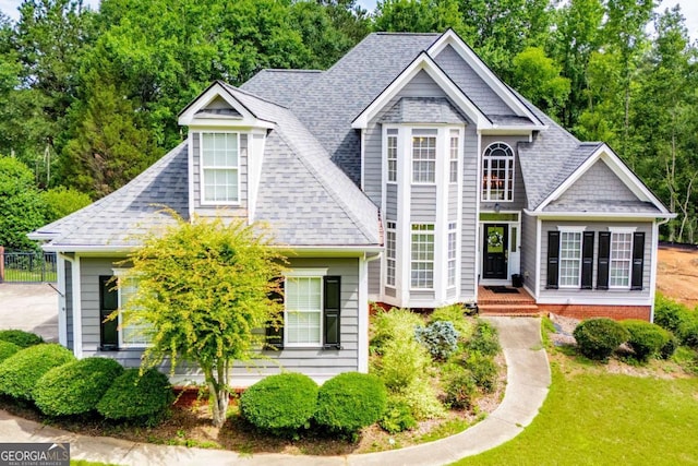 204 Pinehurst Way, Carrollton, GA 30116 - view of front facade with a shingled roof and a front yard