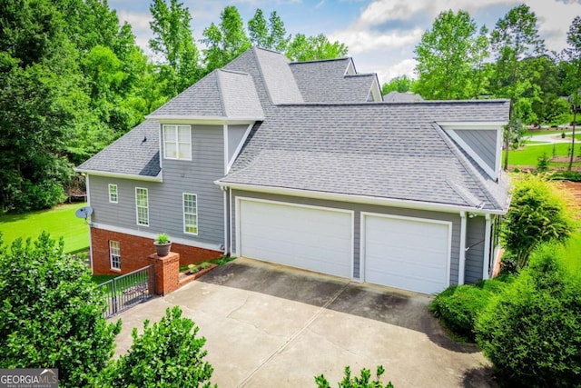 204 Pinehurst Way, Carrollton, GA 30116 - view of home's exterior featuring roof with shingles, a garage, and driveway