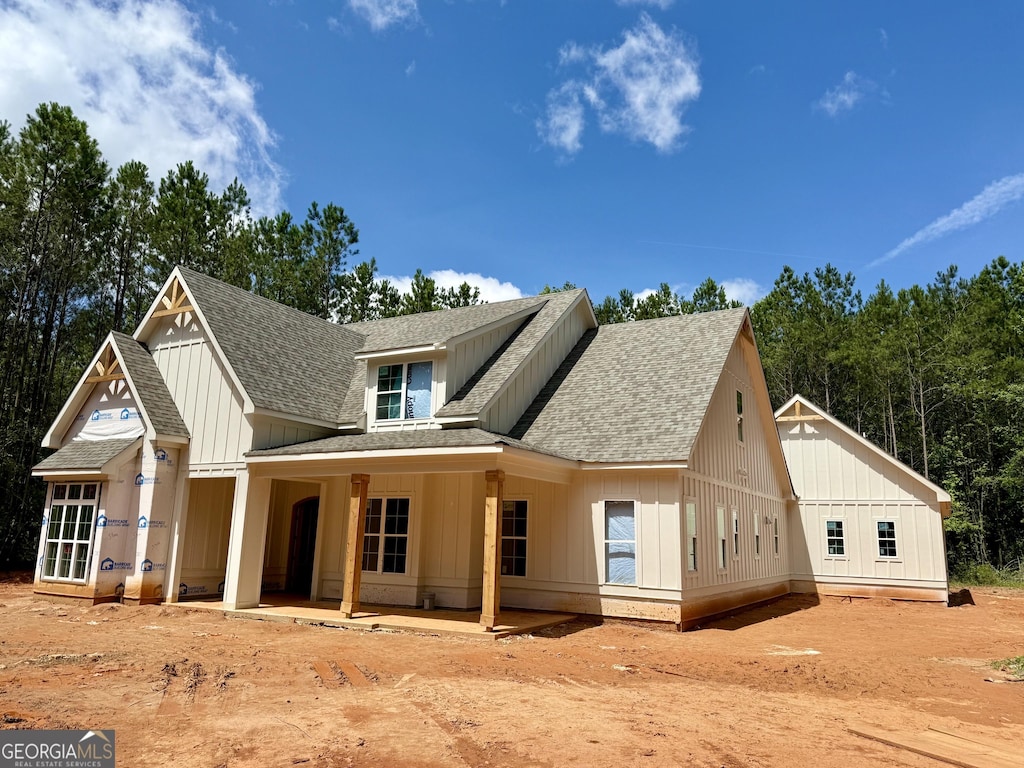 4 Bob Smith Rd, Sharpsburg, GA 30277 - modern farmhouse style home featuring a shingled roof and board and batten siding