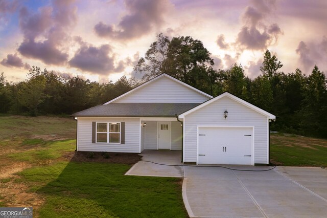266 Patillo Rd, Jackson, GA 30233 - view of front of property featuring driveway, an attached garage, and a front lawn