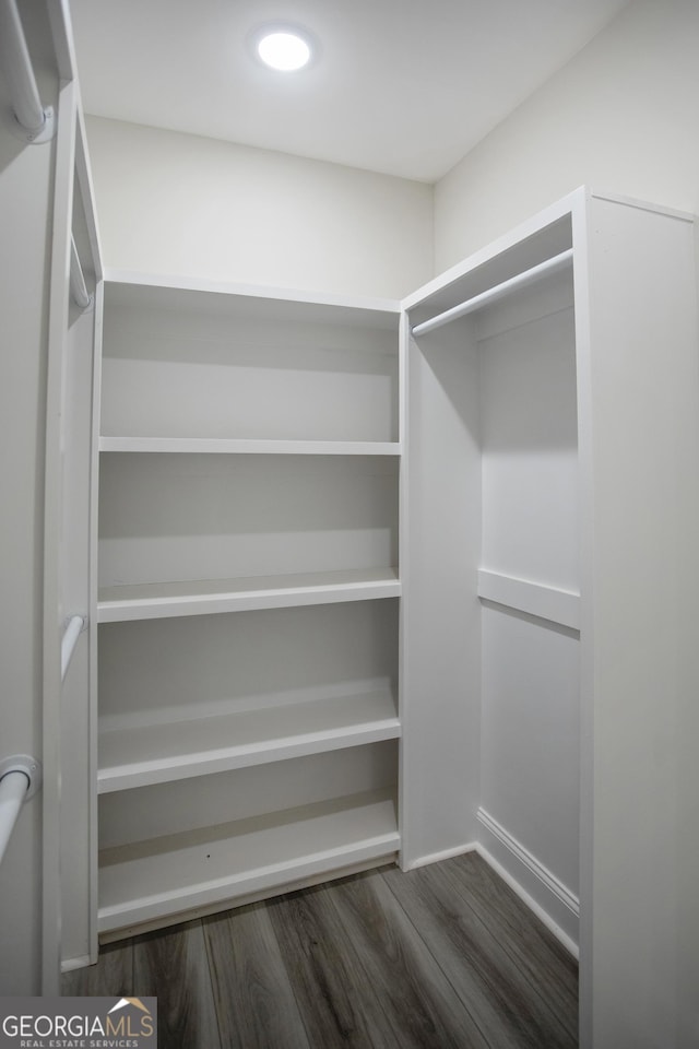 266 Patillo Rd, Jackson, GA 30233 - spacious closet with dark wood-style floors