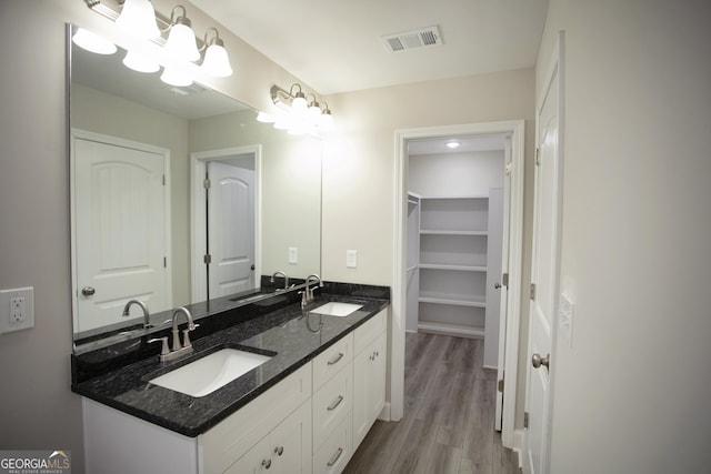 266 Patillo Rd, Jackson, GA 30233 - bathroom featuring double vanity and wood finished floors