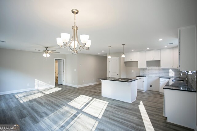 266 Patillo Rd, Jackson, GA 30233 - kitchen featuring dark countertops, a ceiling fan, a chandelier, recessed lighting, and white cabinets