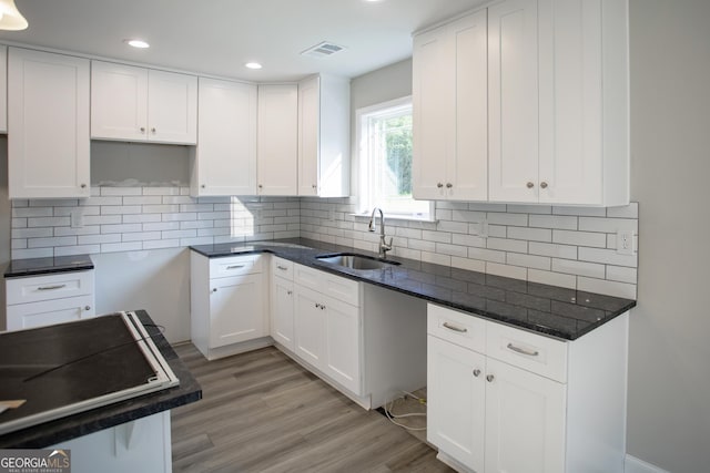 266 Patillo Rd, Jackson, GA 30233 - kitchen featuring light wood-style flooring, recessed lighting, white cabinets, and backsplash