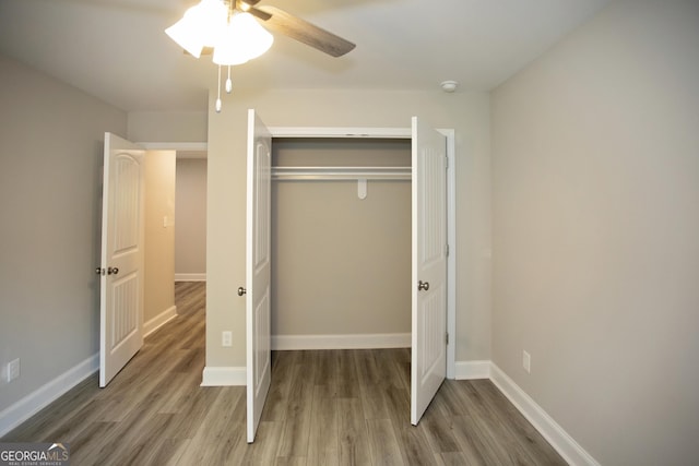 266 Patillo Rd, Jackson, GA 30233 - unfurnished bedroom with wood finished floors, a closet, and ceiling fan