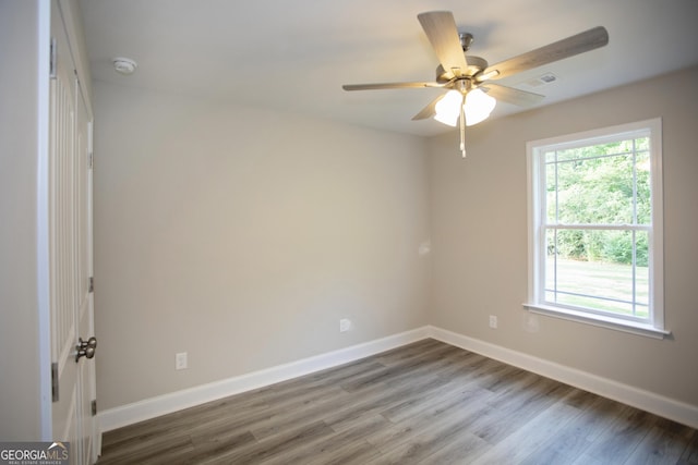 266 Patillo Rd, Jackson, GA 30233 - unfurnished room featuring a smoke detector, wood finished floors, and a ceiling fan