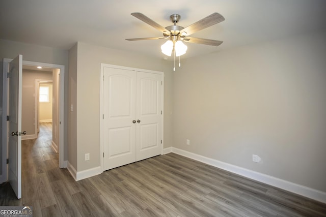 266 Patillo Rd, Jackson, GA 30233 - unfurnished bedroom featuring a closet, wood finished floors, and a ceiling fan