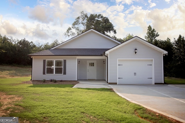 266 Patillo Rd, Jackson, GA 30233 - view of front of property with an attached garage, concrete driveway, a front yard, and a shingled roof