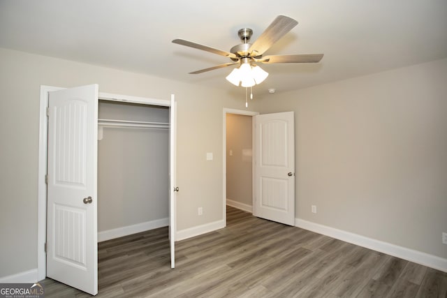 266 Patillo Rd, Jackson, GA 30233 - unfurnished bedroom featuring wood finished floors, a closet, and ceiling fan