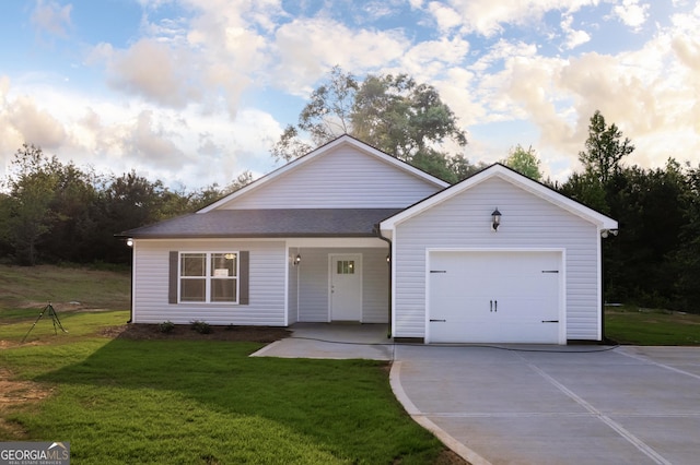 266 Patillo Rd, Jackson, GA 30233 - view of front facade featuring driveway, an attached garage, and a front lawn