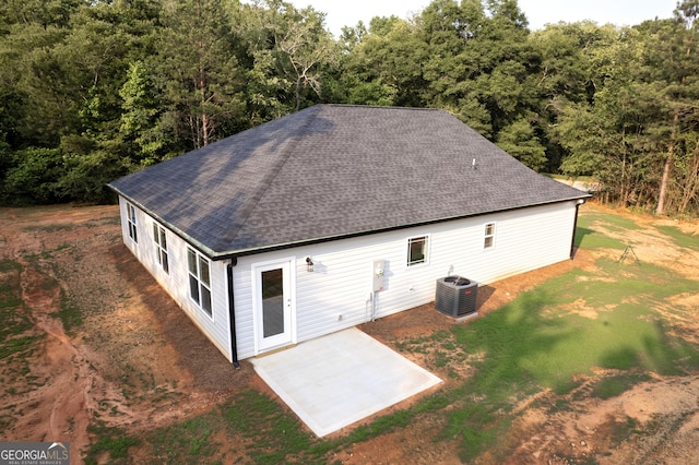 266 Patillo Rd, Jackson, GA 30233 - rear view of house with roof with shingles, a patio, a yard, and a forest view