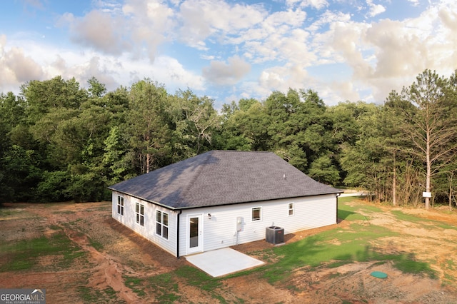 266 Patillo Rd, Jackson, GA 30233 - view of side of property featuring a shingled roof, a patio, a yard, and a view of trees