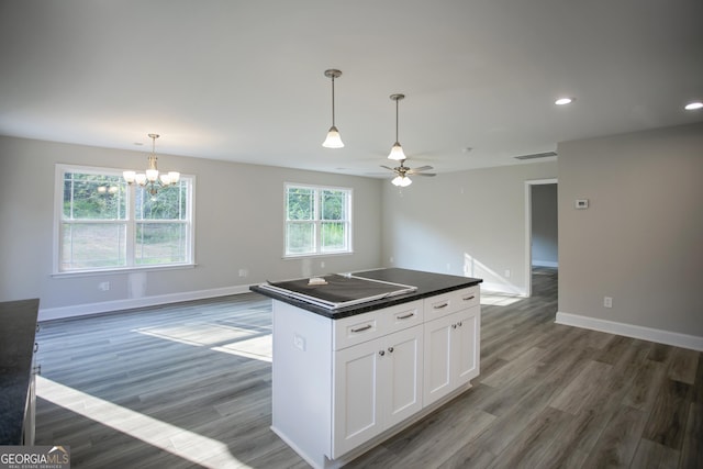 266 Patillo Rd, Jackson, GA 30233 - kitchen featuring white cabinets, open floor plan, a chandelier, dark countertops, and recessed lighting