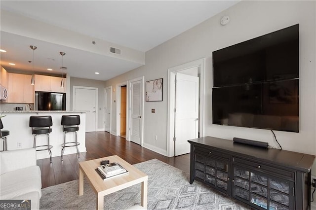 905 Juniper St NE Unit 701, Atlanta, GA 30309 - living room featuring wood finished floors and recessed lighting