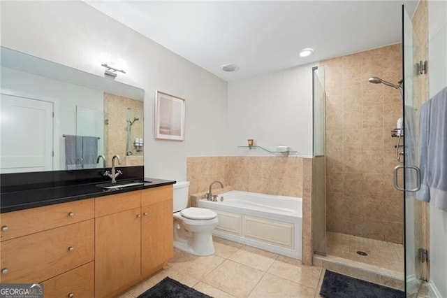 905 Juniper St NE Unit 701, Atlanta, GA 30309 - full bathroom featuring tile patterned floors, a stall shower, vanity, and a bath