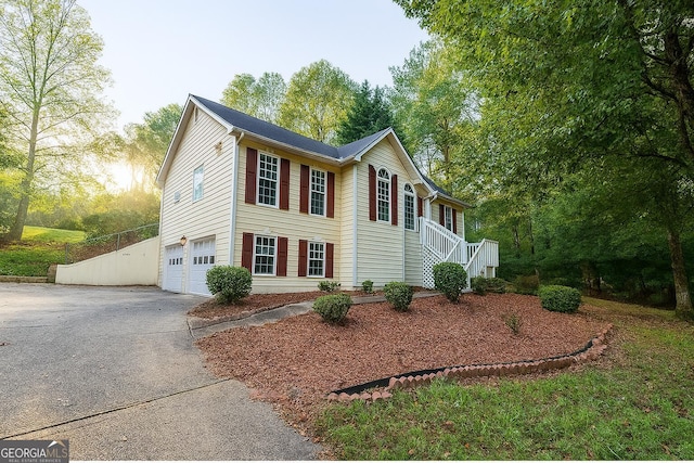 1858 Mcconnell Rd, Grayson, GA 30017 - view of front of property featuring asphalt driveway, an attached garage, and stairway