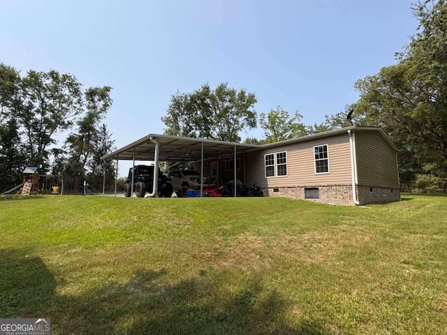 601 Auburn Rd, Glennville, GA 30427 - rear view of property with a lawn, crawl space, and a carport