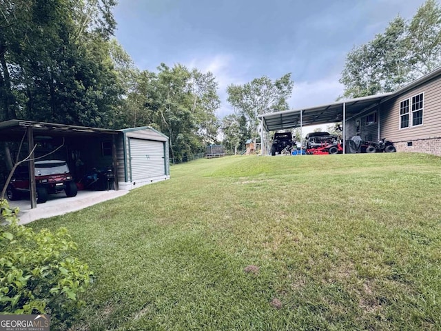 601 Auburn Rd, Glennville, GA 30427 - view of grassy yard with a carport and an outbuilding