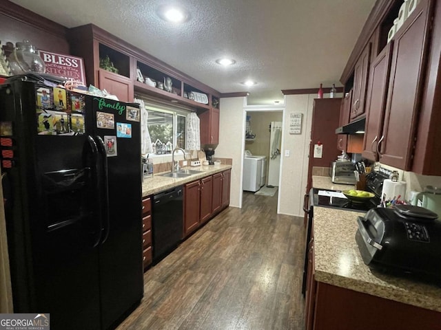 601 Auburn Rd, Glennville, GA 30427 - kitchen with black appliances, under cabinet range hood, dark wood-type flooring, a textured ceiling, and light countertops