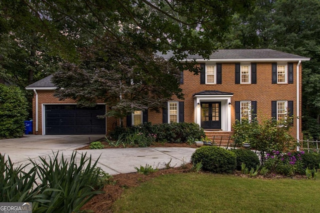 1379 Cambridge Ct NE, Brookhaven, GA 30319 - colonial-style house with french doors, driveway, brick siding, a garage, and a front lawn