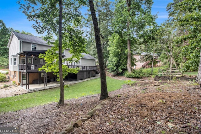 1379 Cambridge Ct NE, Brookhaven, GA 30319 - view of grassy yard featuring a patio area and a wooden deck