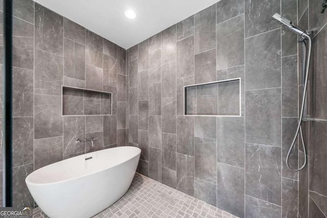 32 Walthall St NE Unit A, Atlanta, GA 30307 - bathroom with tiled shower, a freestanding bath, recessed lighting, and tile walls