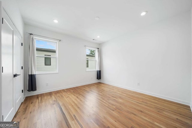 32 Walthall St NE Unit A, Atlanta, GA 30307 - unfurnished room featuring light wood-style floors and recessed lighting