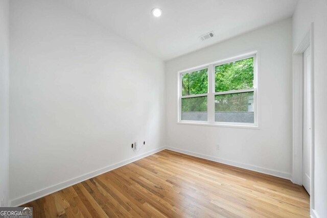 32 Walthall St NE Unit A, Atlanta, GA 30307 - spare room with light wood finished floors and baseboards