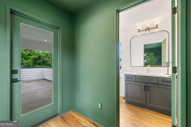 32 Walthall St NE Unit A, Atlanta, GA 30307 - entryway with a sink and light wood finished floors