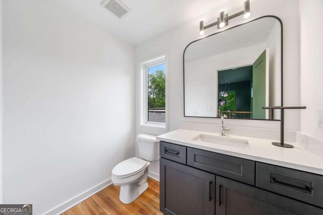 32 Walthall St NE Unit A, Atlanta, GA 30307 - bathroom with wood finished floors and vanity