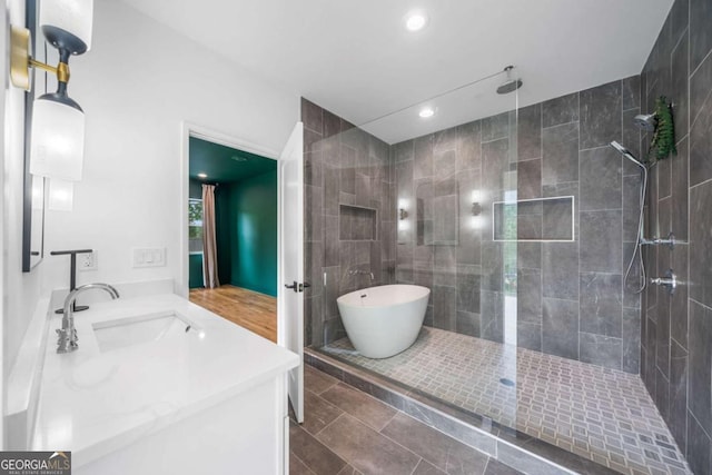 32 Walthall St NE Unit A, Atlanta, GA 30307 - full bathroom with double vanity, tiled shower, a soaking tub, and recessed lighting