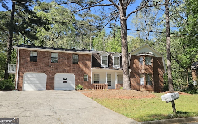 2498 Robinhood Dr Unit 3, Ellenwood, GA 30294 - view of front of property with asphalt driveway, a porch, a garage, and brick siding