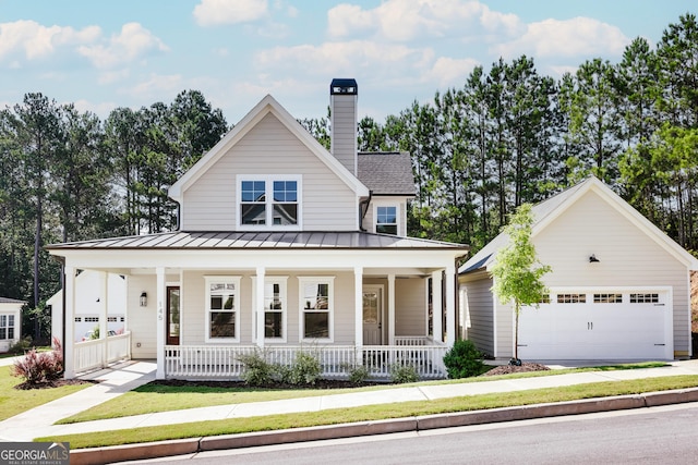 145 Holmes Ave, Athens, GA 30606 - view of front of house featuring covered porch, a standing seam roof, and a front yard