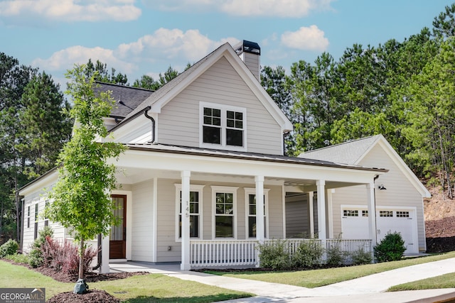 145 Holmes Ave, Athens, GA 30606 - view of front of home with a porch, a chimney, an attached garage, and a shingled roof