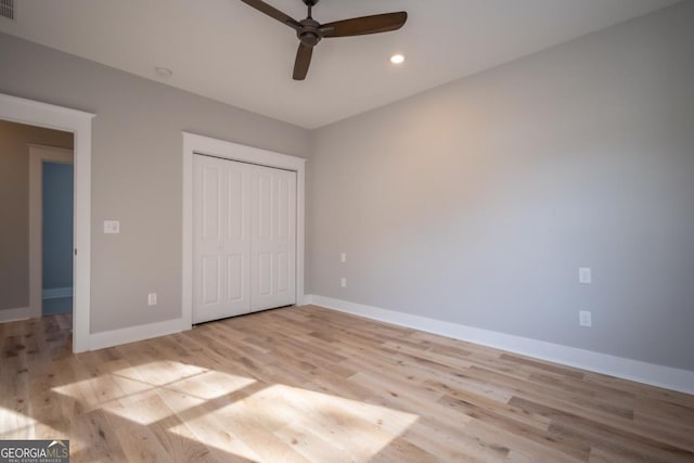 145 Holmes Ave, Athens, GA 30606 - unfurnished bedroom with light wood finished floors, recessed lighting, a closet, and a ceiling fan